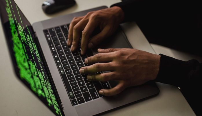 hacker working on a laptop